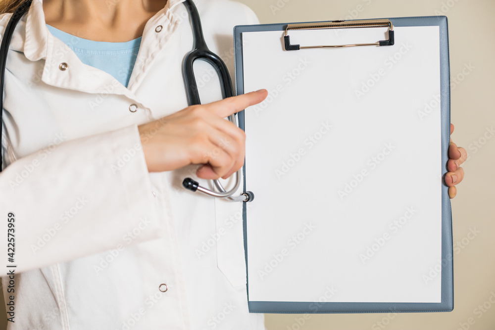 Image of female doctor showing on clipboard Image of female doctor showing on clipboard