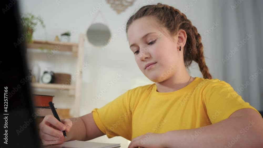 Girl video call. Online home education at lockdown. Virtual communication school. Girl making video call on laptop for online education. Virtual communication at school. Girl at home virtual education Girl video call. Online home education at lockdown. Virtual communication school. Girl making video call on laptop for online education. Virtual communication at school. Girl at home virtual education