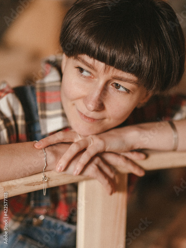 Girl woodworker in a country 