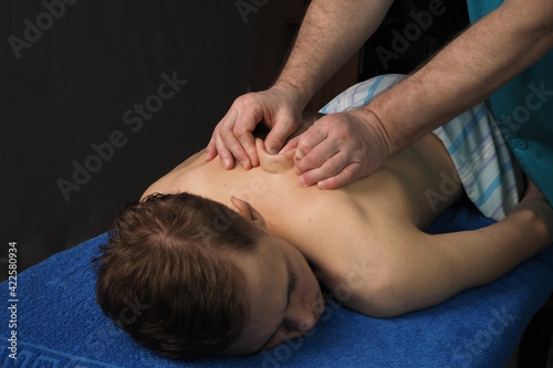 The back massage is manual. The specialist massages the back