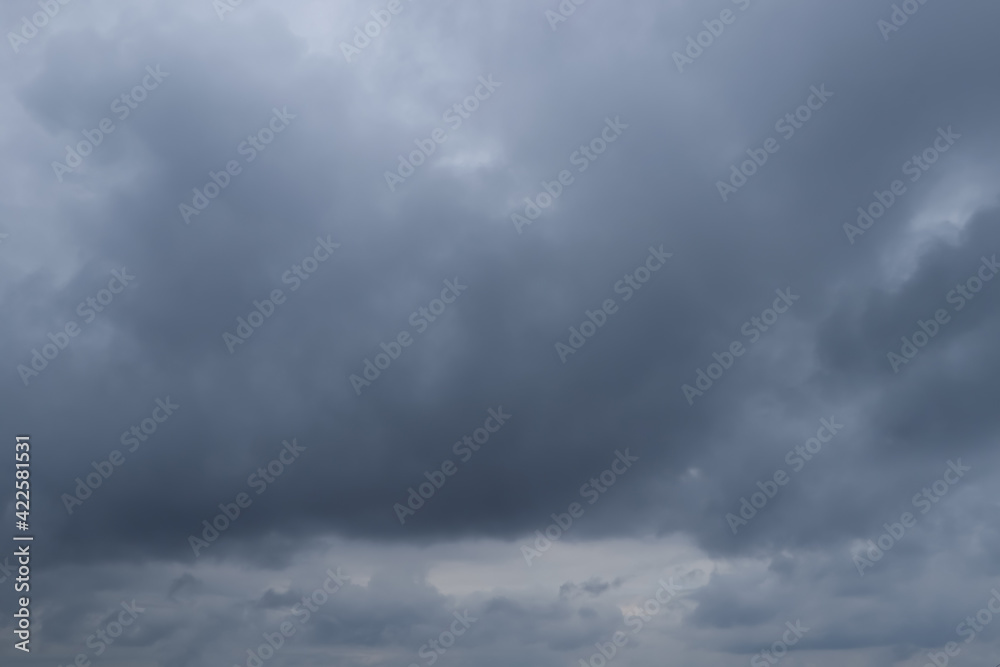 Sky with heavy rainy clouds on grey day