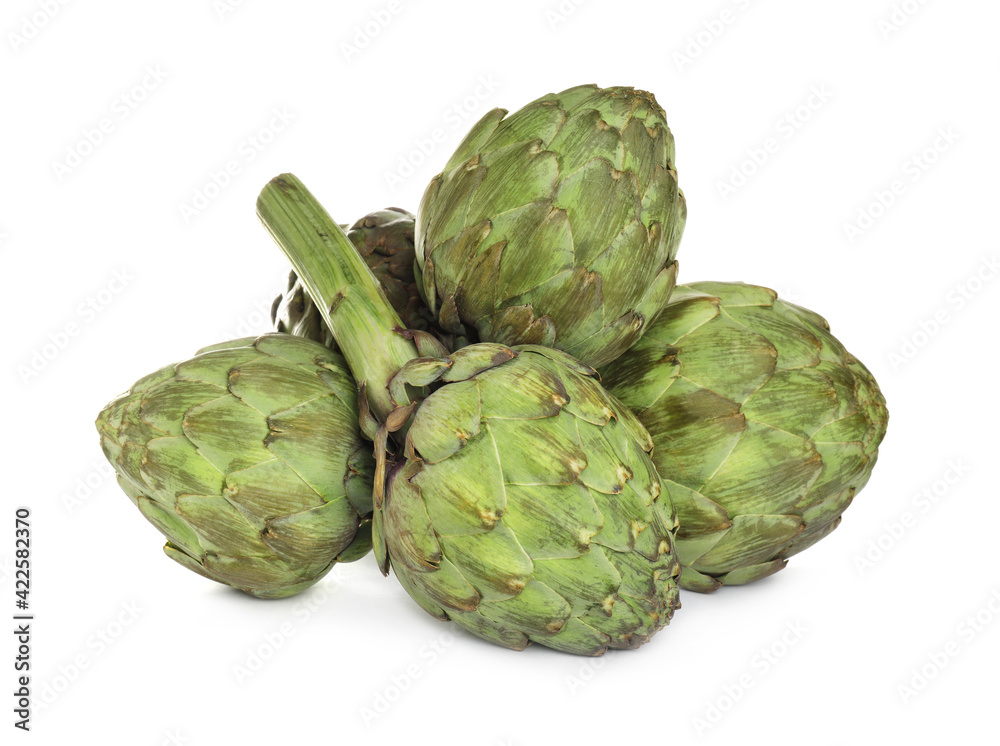 Whole fresh raw artichokes on white background