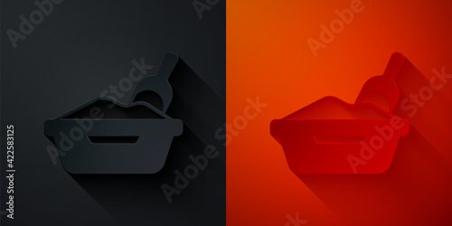 Paper cut Cat litter tray with shovel icon isolated on black and red background. Sandbox cat with shovel. Paper art style. Vector