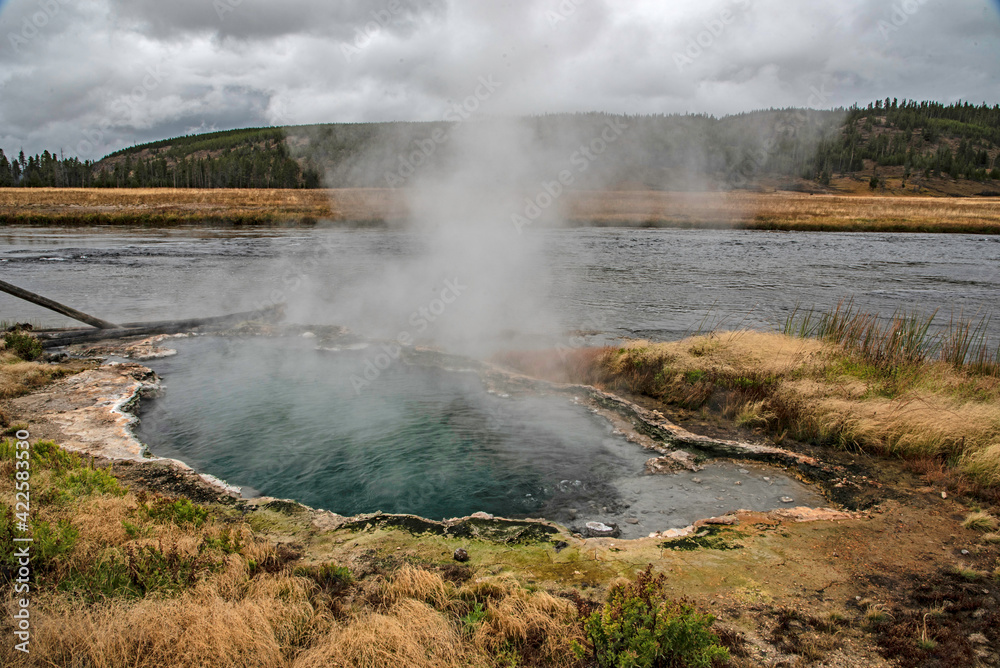 Rising Geysers in the Yellowstone National Park landscape. Rising Geysers in the Yellowstone National Park landscape.