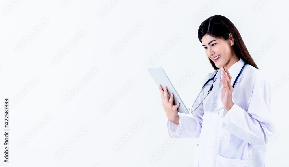 Asian attractive woman doctor Looking at and using a tablet To provide advice to patients By communication online On white background, to health care and doctor online concept. Asian attractive woman doctor Looking at and using a tablet To provide advice to patients By communication online On white background, to health care and doctor online concept.