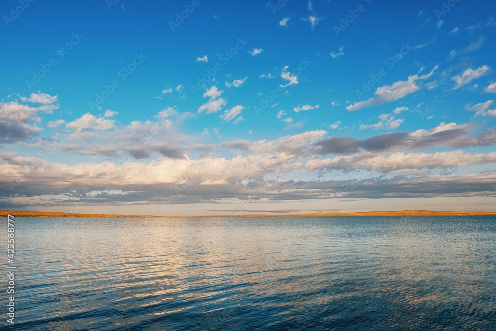 View of the lakes in Tuva during sunrise, blue sky and light on the clouds