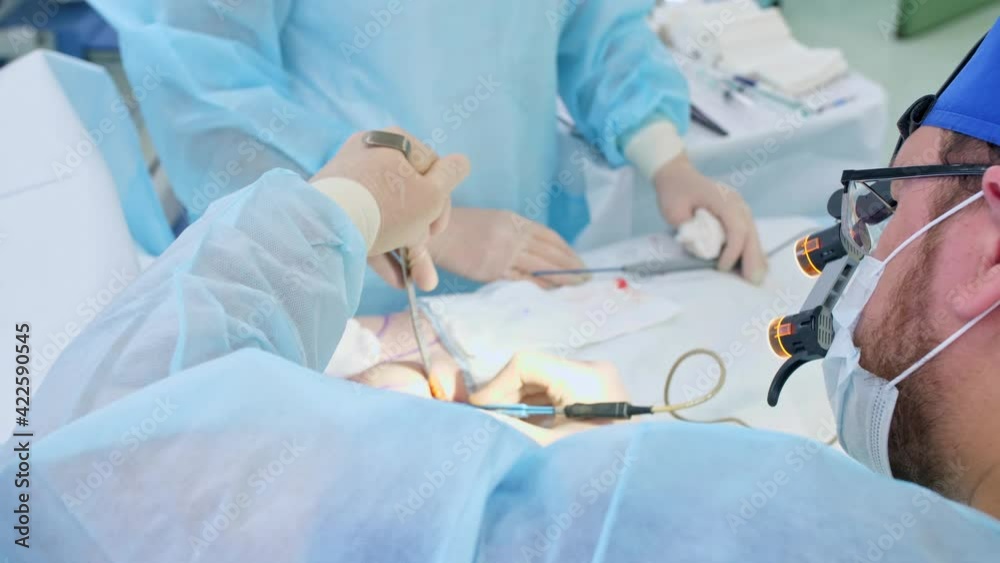 the surgeon performs a surgical operation