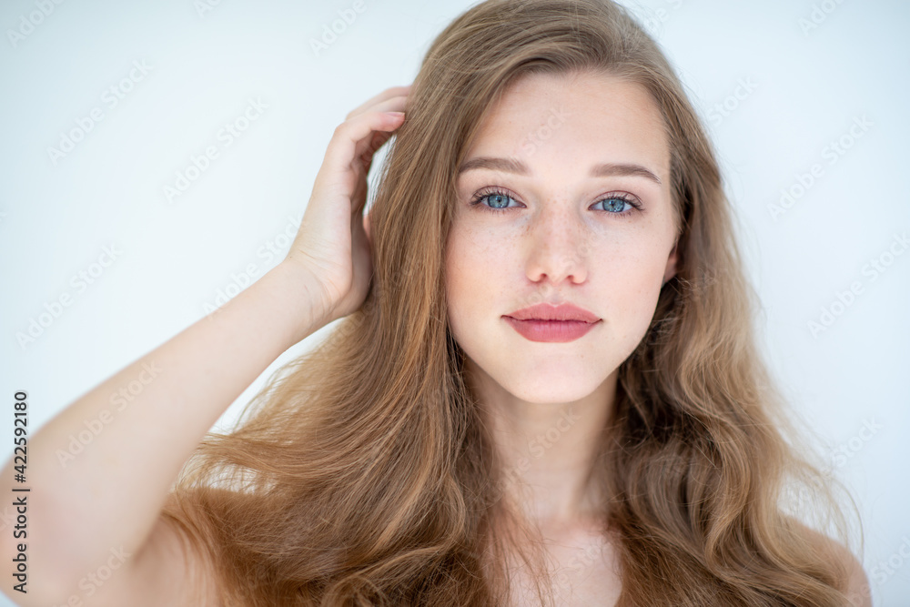 Portrait of a beautiful young woman with clean skin, beauty treatment, cosmetology and anti-aging theme Portrait of a beautiful young woman with clean skin, beauty treatment, cosmetology and anti-aging theme