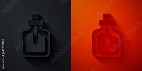 Paper cut Perfume icon isolated on black and red background. Paper art style. Vector