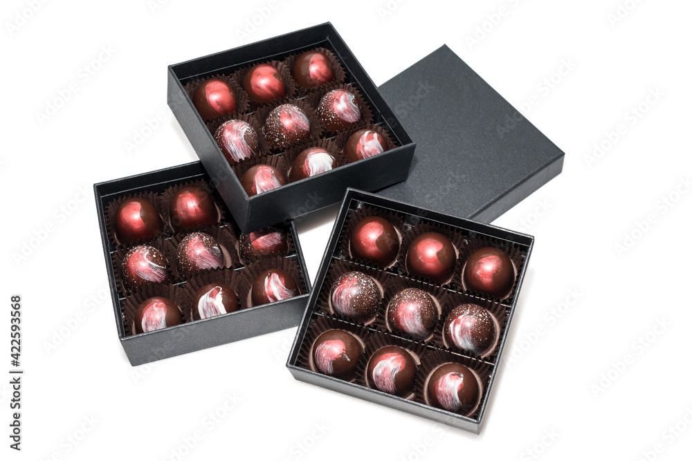 Chocolate candies in giftboxes isolated on white background. Assorted chocolates confectionery in their gift boxes. Set of colorful chocolate bonbons. Chocolate candies in giftboxes isolated on white background. Assorted chocolates confectionery in their gift boxes. Set of colorful chocolate bonbons.