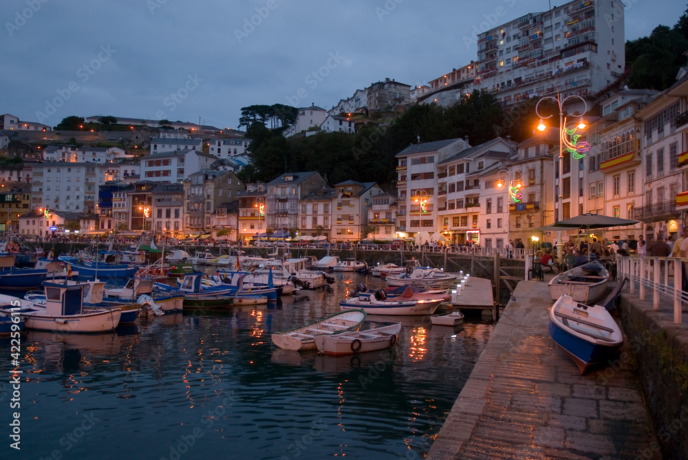 Night view of the old harbor in Luarca, Spain