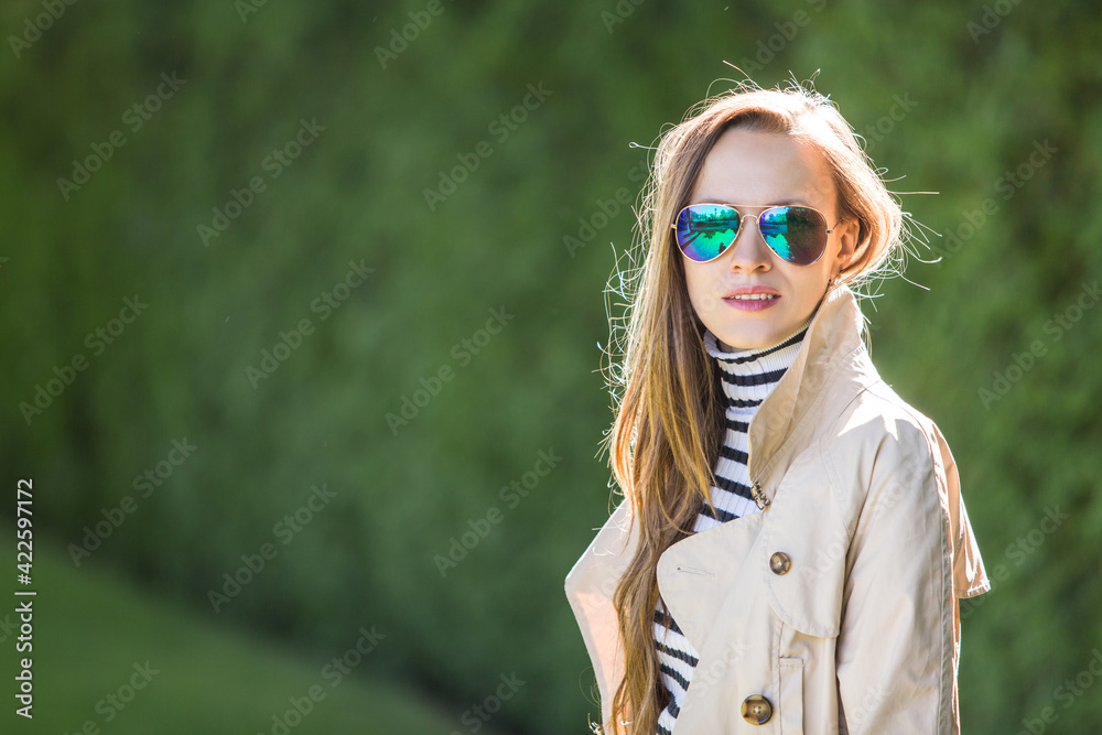 Outdoor portrait of positive confident woman