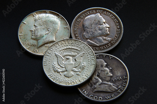 United States silver coins on dark background