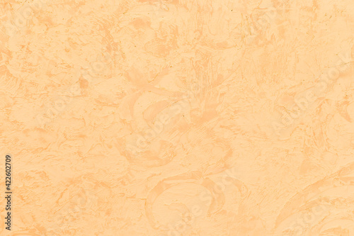 Abstract light yellow pattern decorative sand plaster wall texture stucco background
