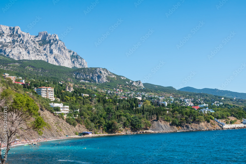 View of the sea and cliffs. Tourism in the Crimea. Summer photo of a sea landscape.