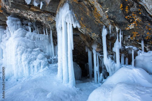 Ice cave, Icicles in the rocky caves, Lake Baikal in winter, Siberia