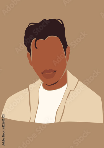 Tanned skin man on the brown isolated background. Dark skin guy portrait. 