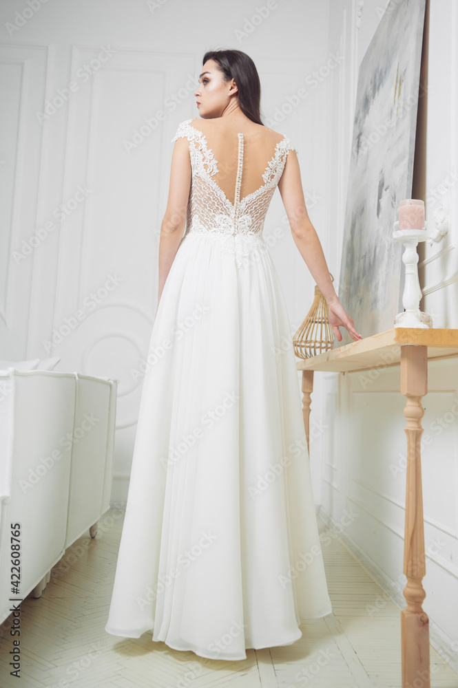 Portrait of a beautiful girl in a wedding dress