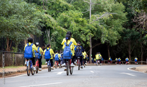 school kids bike touring parking to learn about nature