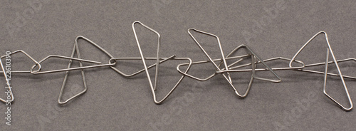 Bilde på lerret Paper clips attached to each other