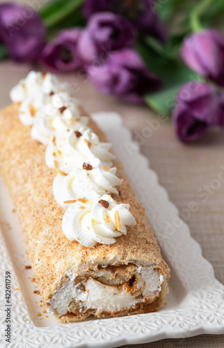  Homemade cake roll with  cream,  and  caramel and coconut. Gluten free