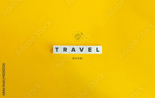 Travel Boom Banner, Icon and Concept. Block letter tiles of bright orange background.