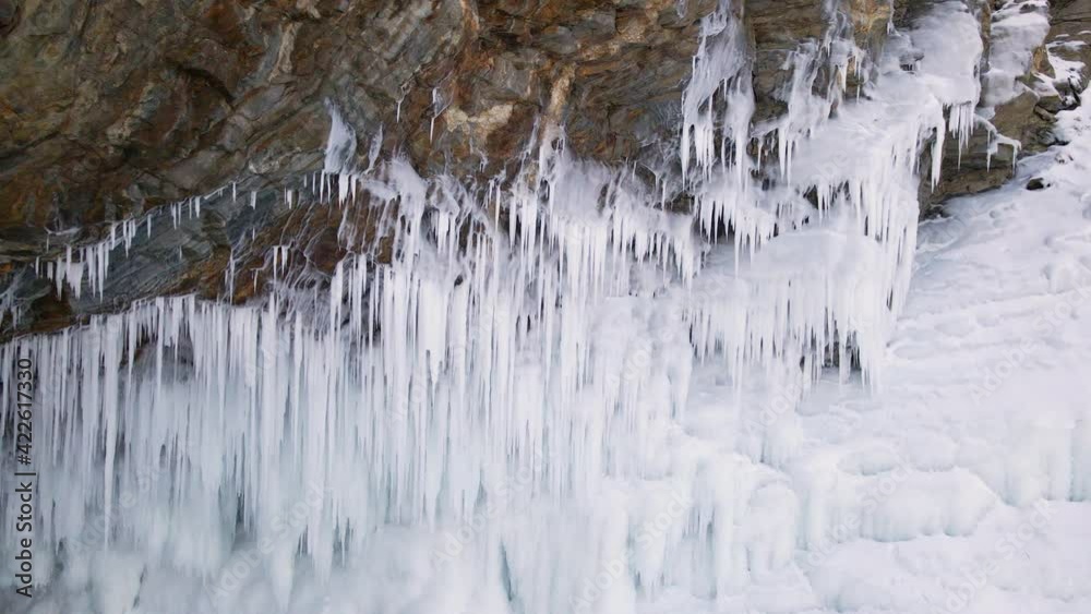 Ice Grotto with Icicles at Baikal Lake in Russia. Aerial View Ice Grotto with Icicles at Baikal Lake in Russia. Aerial View