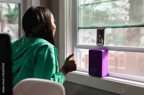 Black teen girl doing live video social media chat