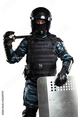 Soldiers in full uniform with armor, baton, protective shield. Uniform conforms to Police Special Purpose Mobile Unit. Patch on the rude with the inscription Police in Russian. White background photo