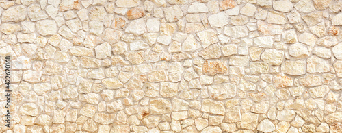 Vászonkép Stonewall background texture. building facade, fence banner