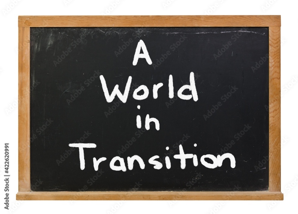 A world in transition written in white chalk on a black chalkboard A world in transition written in white chalk on a black chalkboard