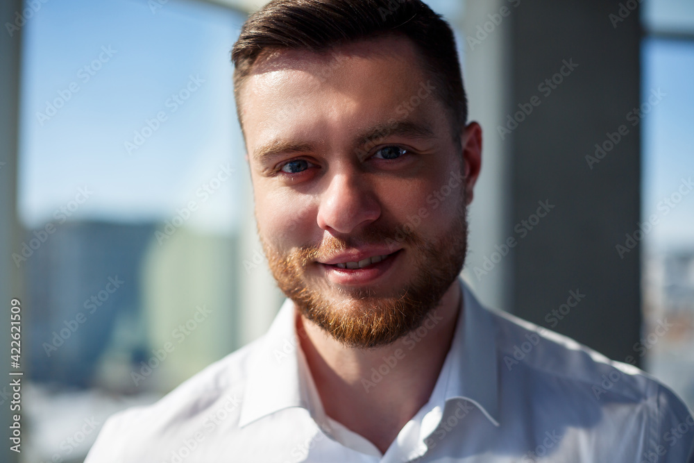 Confident businessman, boss man standing in modern office, successful leader, business owner thinking about future success, planning new opportunities