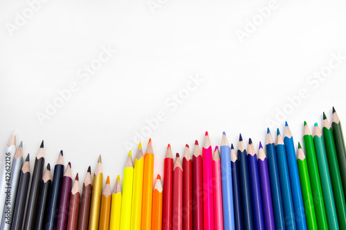 Colorful pencils on white background.