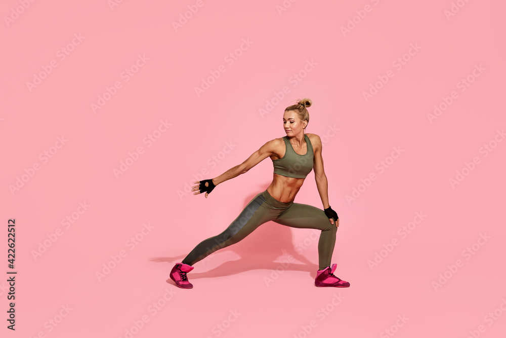sporty woman in a sportswear doing exercise