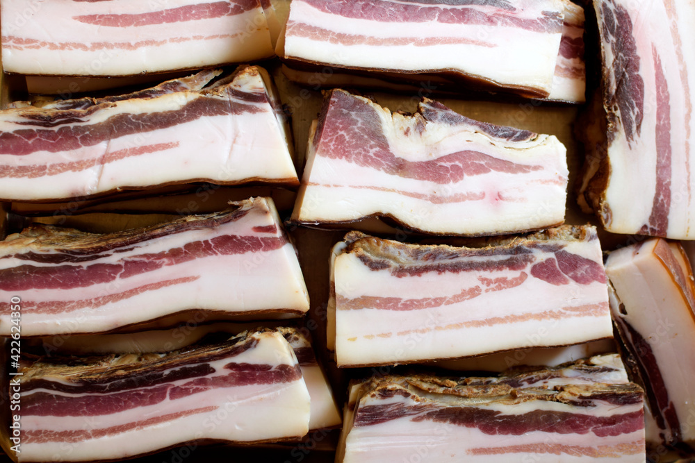 Smoked bacon slices. Natural product from organic farm, produced by traditional methods