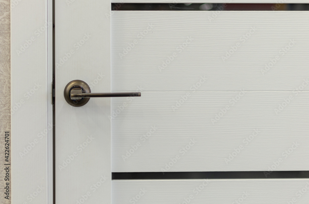Wooden white door with lock and handle. Wooden white door with lock and handle.