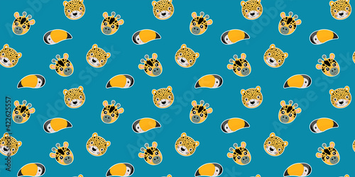 Cartoon seamless pattern of a baby leopard, giraffe, rainbow toucan muzzles on a blue background. Vector.