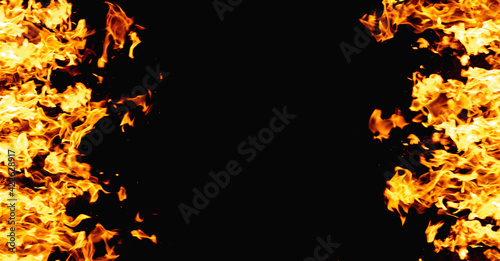 Inferno background. Fire frame. Magma explosion. Bright orange yellow flame glow pattern isolated on black night abstract empty space banner.