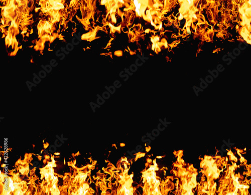 Flame banner. Burning frame. Grill heat. Bright orange yellow fireplace ignite blast glow isolated on black night advertising background with copy space for promotional text.