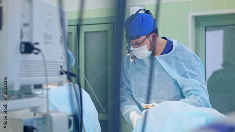 the surgeon performs a surgical operation the surgeon performs a surgical operation