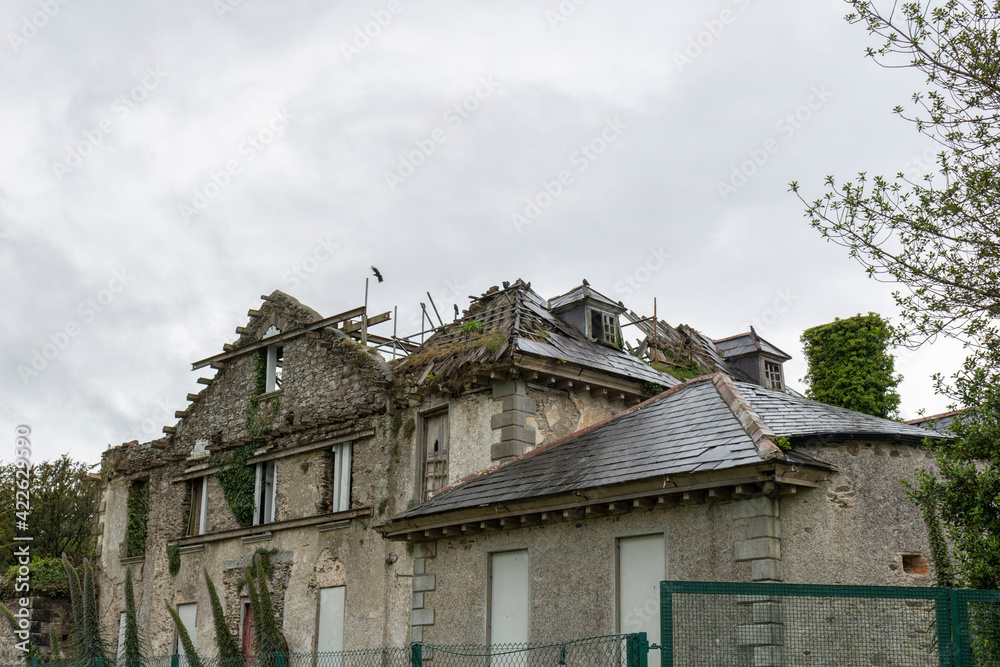 Facade and roof of a destroyed house. 