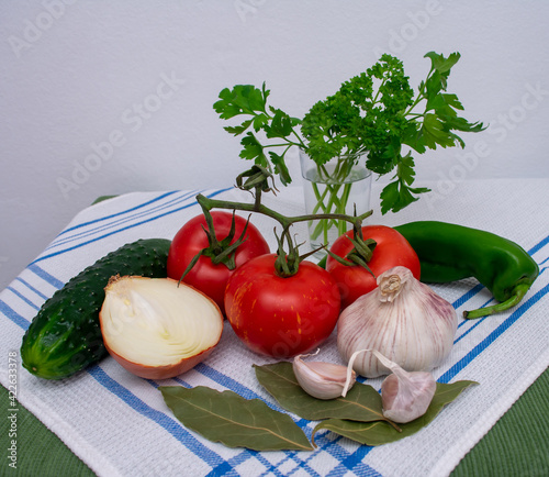 garlic, tomatoes, cucumbers, onions and peppers, Ingredients to make Andalusian gazpacho. 