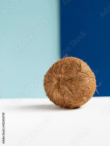 coconut on a blue background. Food and recreation concept.