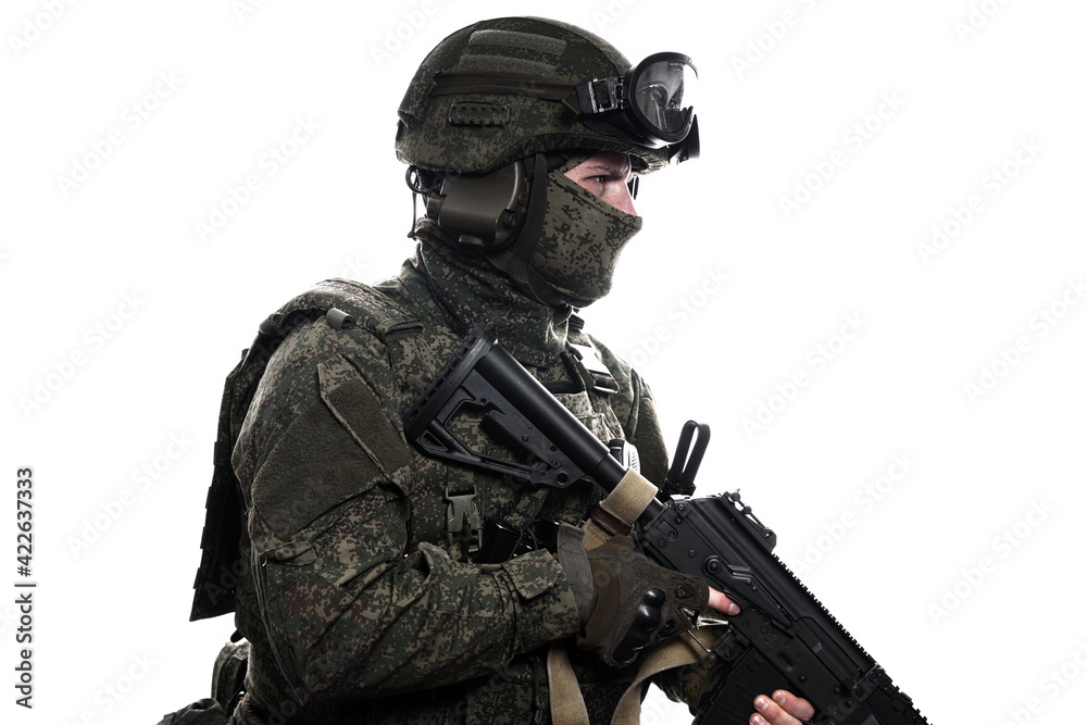 Male soldier in masking camo (green) suit. Shot in studio. Isolated on white background. Male soldier in masking camo (green) suit. Shot in studio. Isolated on white background.