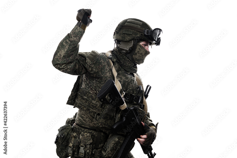 Male soldier in masking camo (green) suit. Shot in studio. Isolated on white background. Male soldier in masking camo (green) suit. Shot in studio. Isolated on white background.