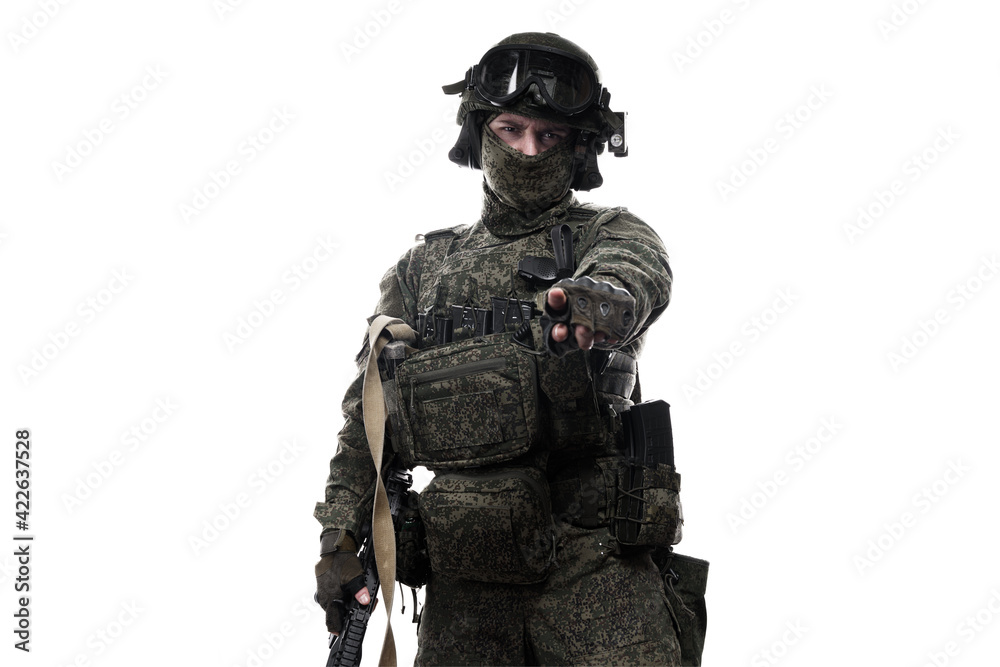 Male soldier in masking camo (green) suit. Shot in studio. Isolated on white background. Male soldier in masking camo (green) suit. Shot in studio. Isolated on white background.