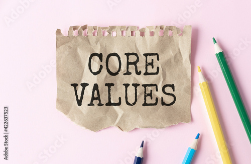 Core Values - text inside notebook on table with pencils