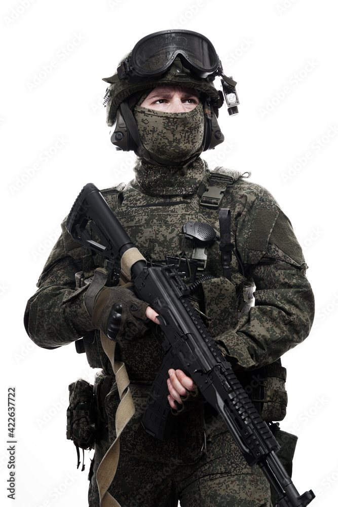 Male soldier in masking camo (green) suit. Shot in studio. Isolated on white background.