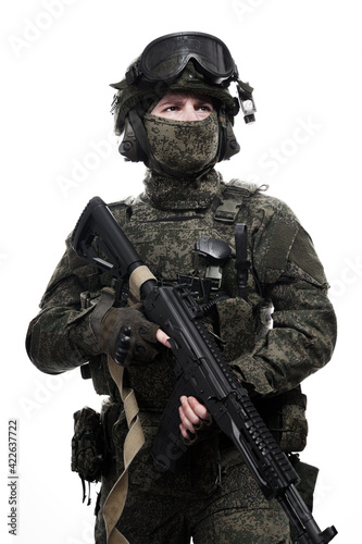 Male soldier in masking camo (green) suit. Shot in studio. Isolated on white background.