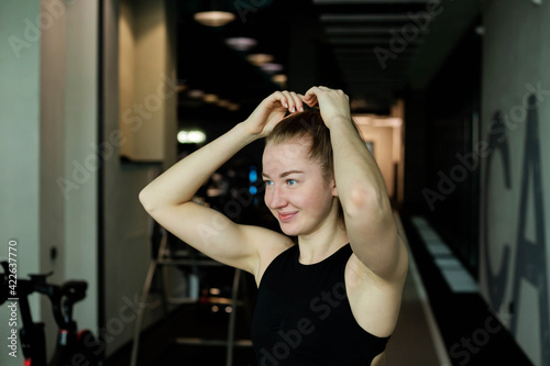 Young attractive girl in sportswear in a fitness club. Sports concept.